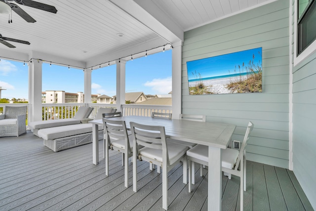 sunroom featuring plenty of natural light and ceiling fan