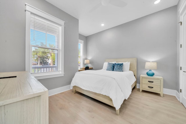 bedroom featuring ceiling fan and light hardwood / wood-style floors