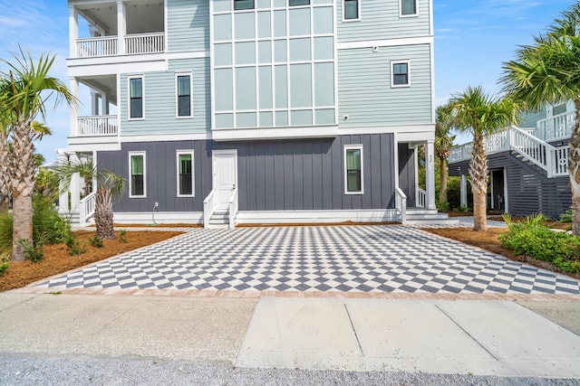 view of front of home with a balcony