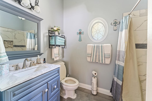 bathroom with large vanity and toilet