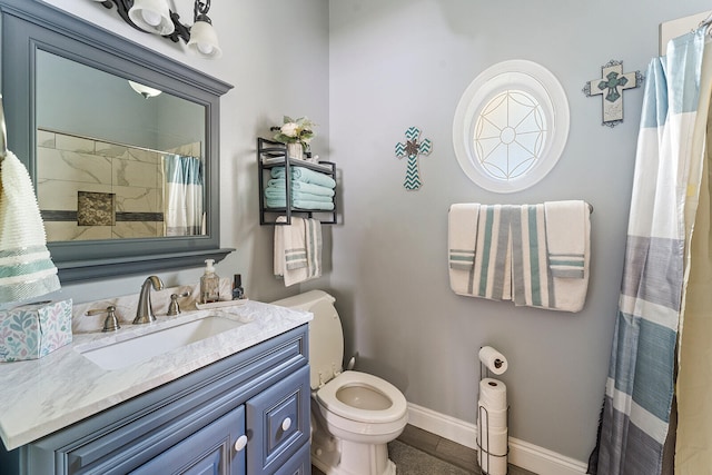 bathroom featuring vanity and toilet