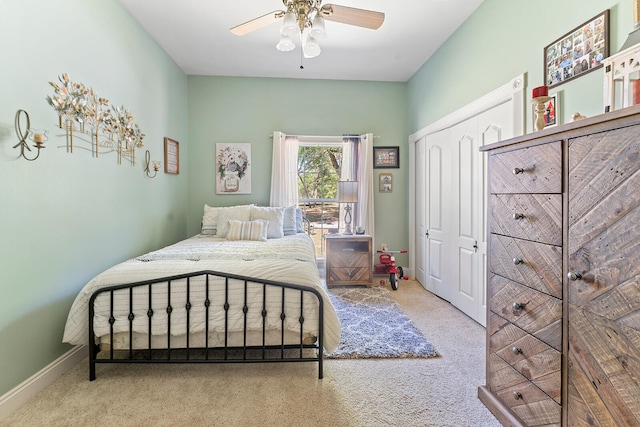 carpeted bedroom with a closet and ceiling fan