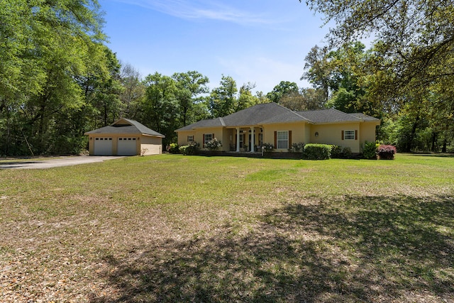 view of front facade featuring a front lawn and a garage