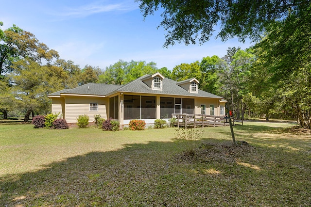 back of house with a yard