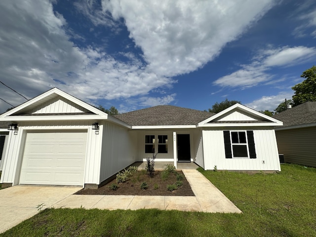 single story home featuring a front yard and a garage