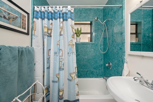 bathroom featuring sink and shower / bath combination with curtain