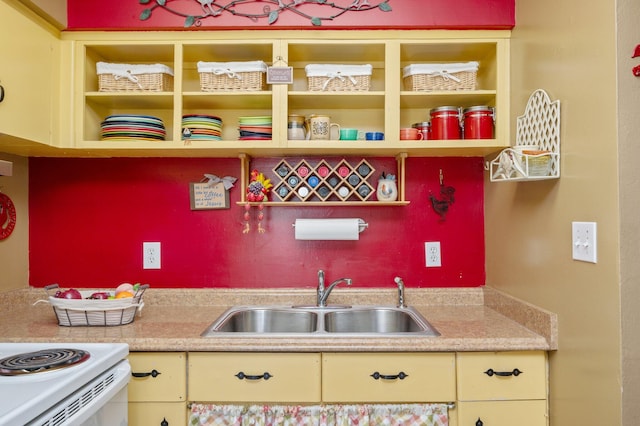 kitchen featuring sink and cream cabinets