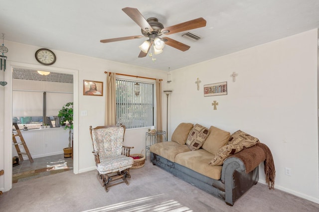 living room with light carpet and ceiling fan