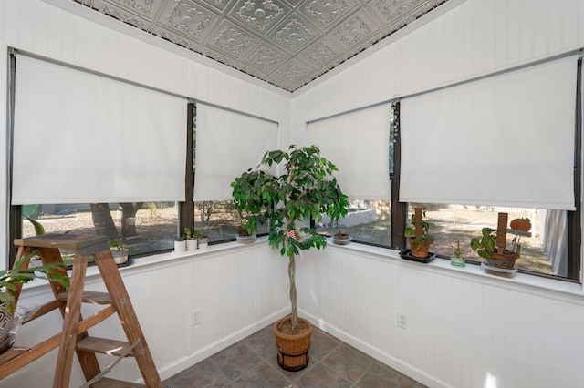 sunroom with a wealth of natural light and vaulted ceiling