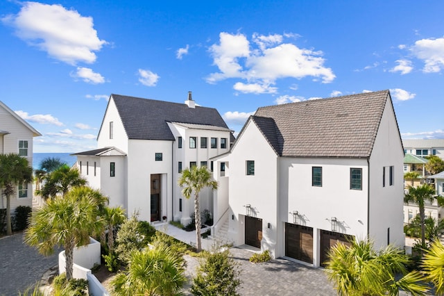 rear view of property featuring a garage