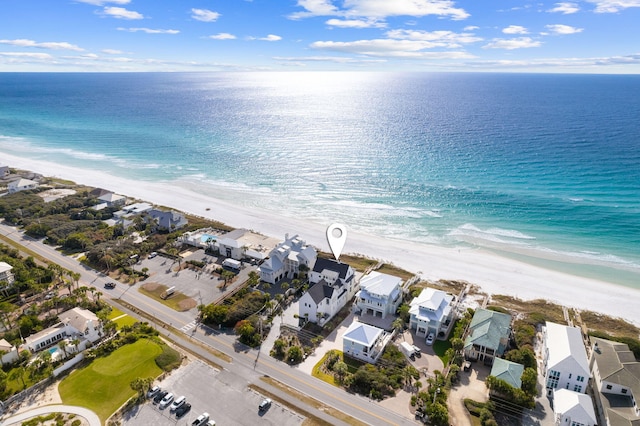 drone / aerial view featuring a view of the beach and a water view