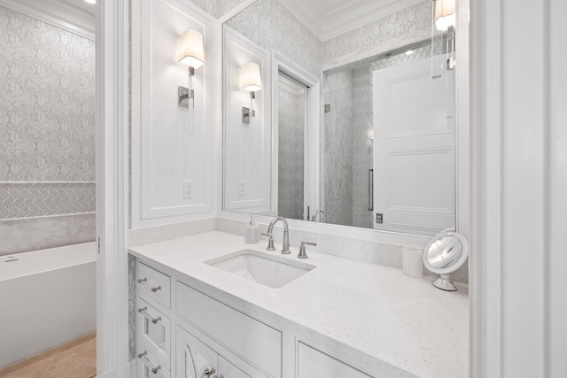 bathroom with vanity with extensive cabinet space and crown molding