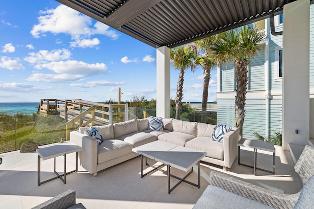 view of patio / terrace with outdoor lounge area and a water view