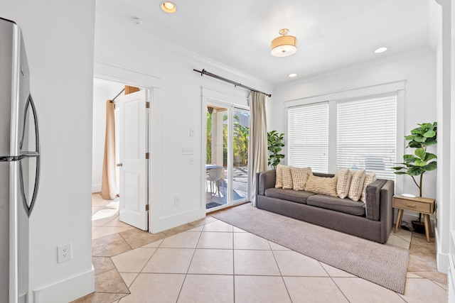 tiled living room featuring ornamental molding