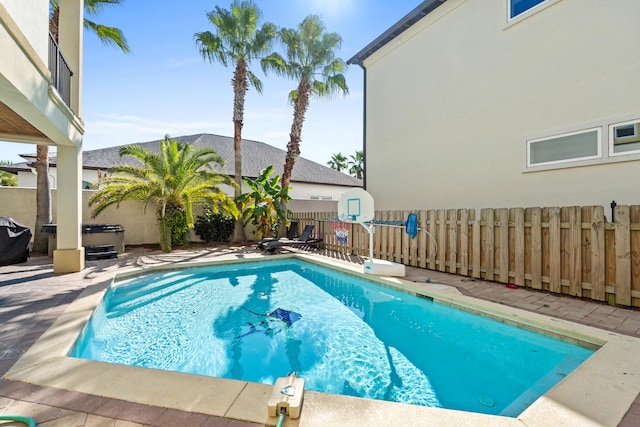 view of swimming pool with a patio area