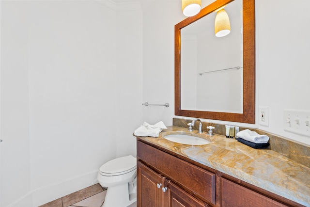 bathroom featuring vanity, tile floors, and toilet