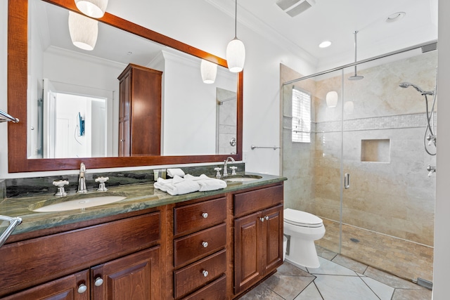 bathroom with an enclosed shower, tile floors, ornamental molding, double sink vanity, and toilet