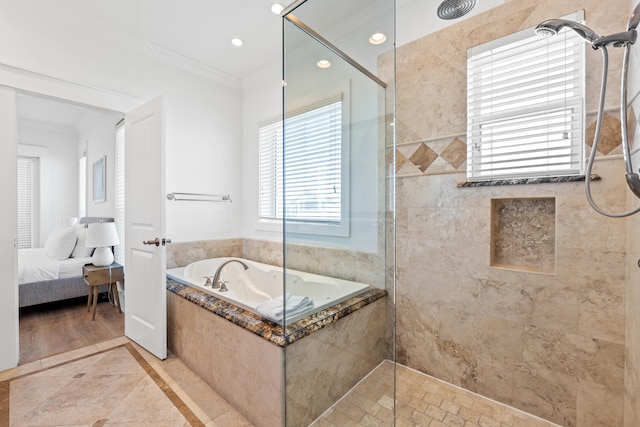 bathroom with ornamental molding, independent shower and bath, and tile floors