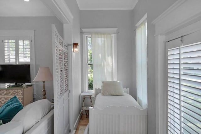 bedroom with multiple windows and ornamental molding