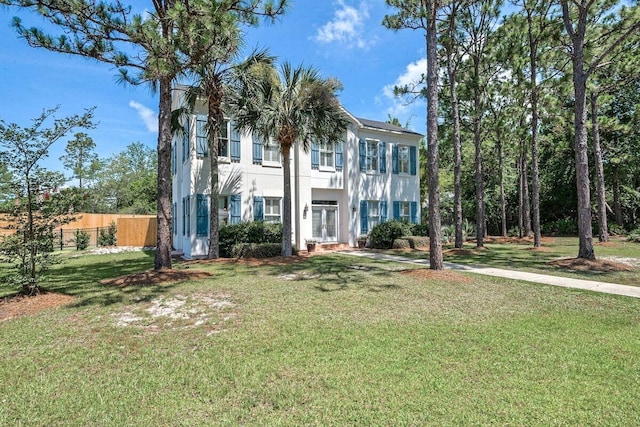 view of front of home with a front lawn