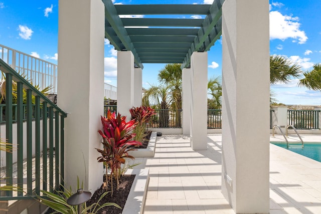 view of patio / terrace featuring a fenced in pool and a pergola