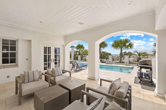 view of patio with fence, an outdoor living space, french doors, grilling area, and a fenced in pool