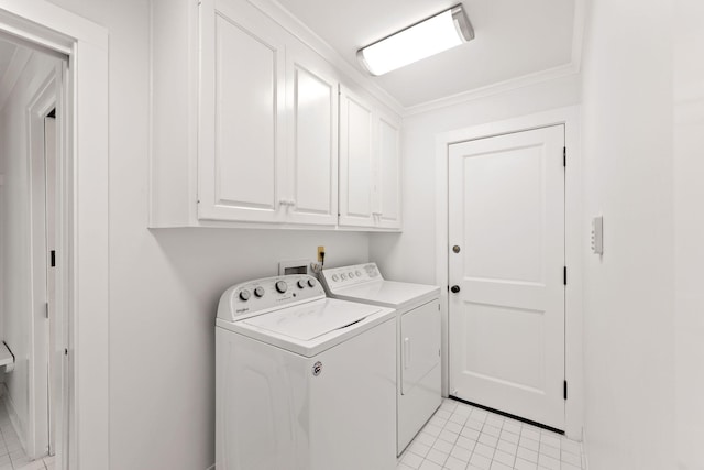 clothes washing area with light tile patterned floors, cabinet space, crown molding, and separate washer and dryer