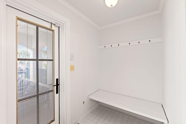 mudroom with ornamental molding, tile patterned flooring, and baseboards