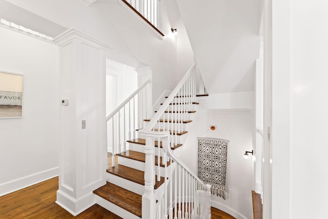 stairs with dark wood-type flooring