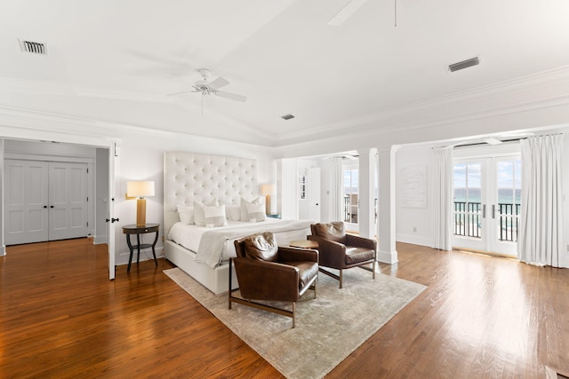 bedroom with ceiling fan, hardwood / wood-style floors, access to outside, vaulted ceiling, and french doors