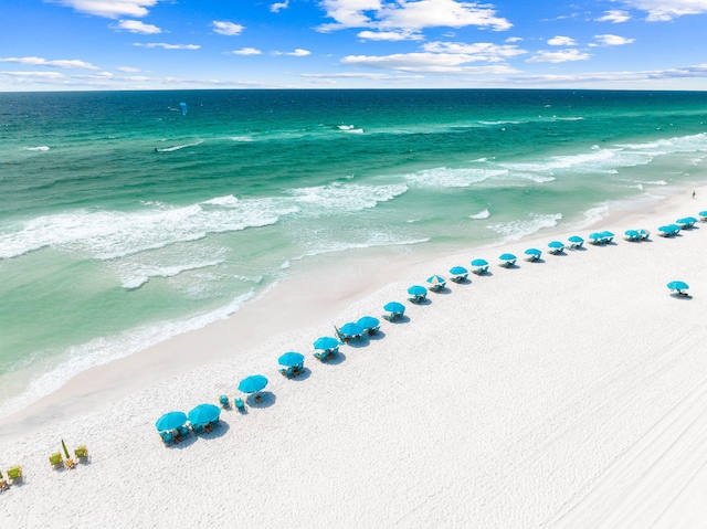 aerial view featuring a view of the beach and a water view