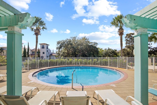 view of swimming pool featuring a patio area