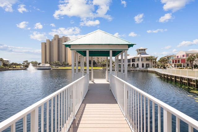 view of dock with a water view and a gazebo