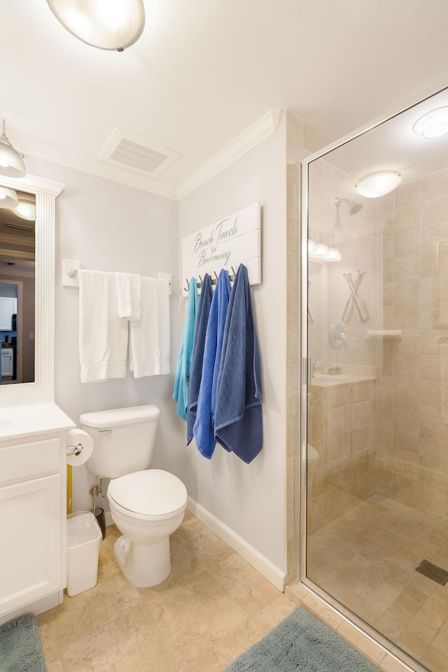 bathroom featuring toilet, vanity, visible vents, ornamental molding, and a stall shower