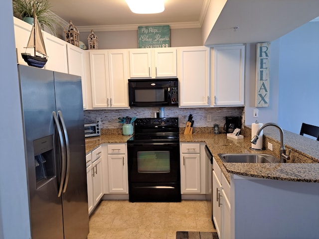 kitchen featuring dark stone counters, black appliances, a sink, and white cabinetry