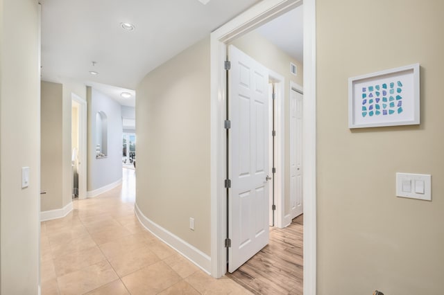 hall with light hardwood / wood-style floors