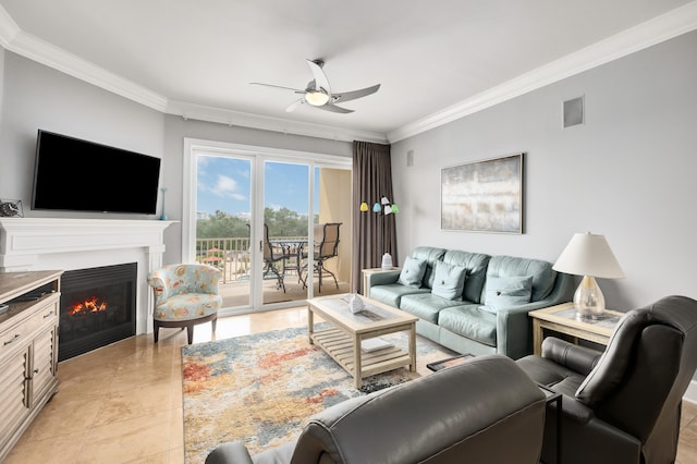 tiled living room with ceiling fan and crown molding