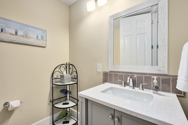 bathroom with backsplash and vanity