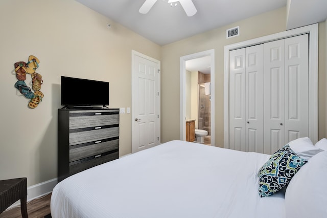 bedroom with a closet, wood-type flooring, ceiling fan, and ensuite bathroom