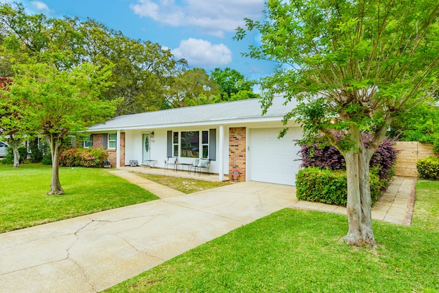 single story home featuring a garage and a front lawn