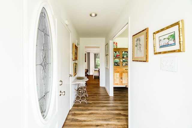 hall with dark wood-type flooring