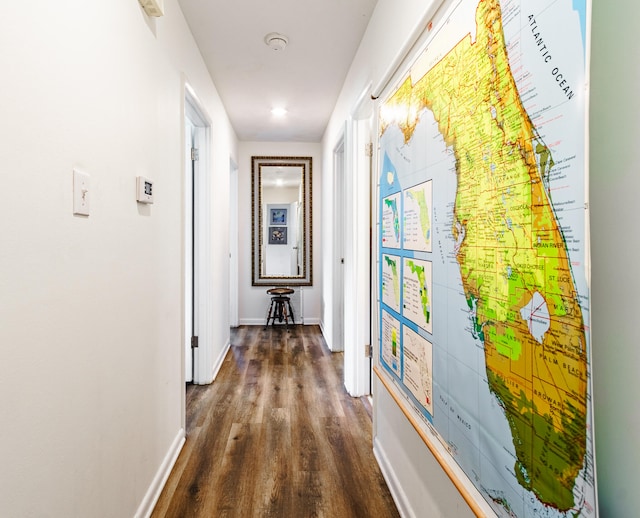 corridor with dark wood-type flooring