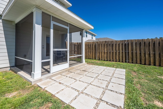 view of patio / terrace with a sunroom