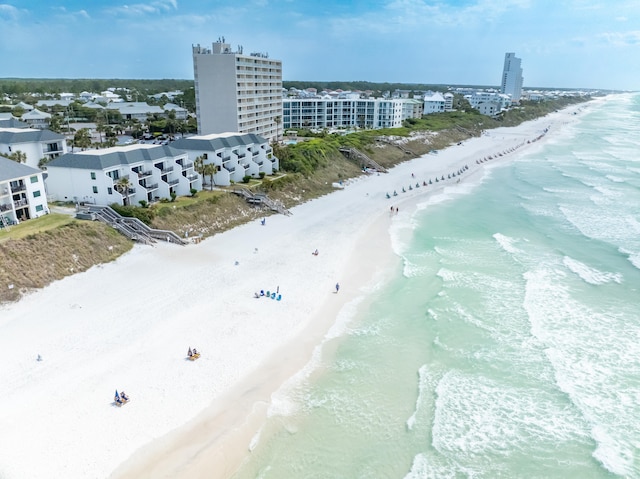 drone / aerial view with a beach view and a water view