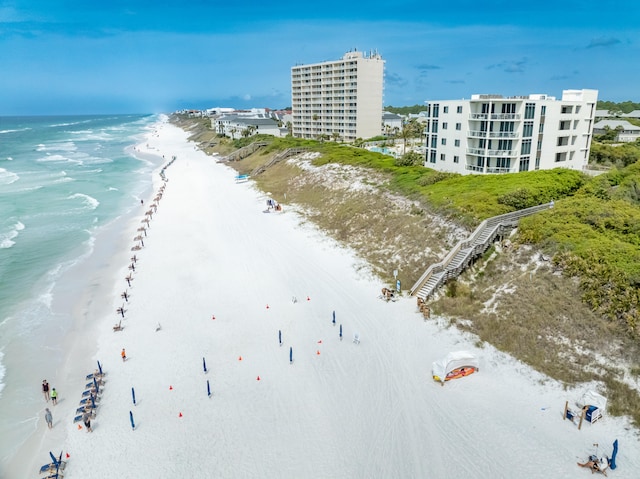 drone / aerial view featuring a view of the beach and a water view