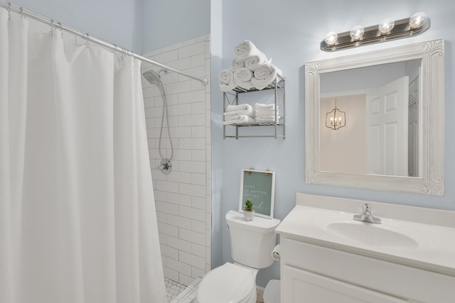 bathroom with walk in shower, toilet, and oversized vanity