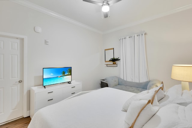 bedroom with ornamental molding, light hardwood / wood-style flooring, and ceiling fan