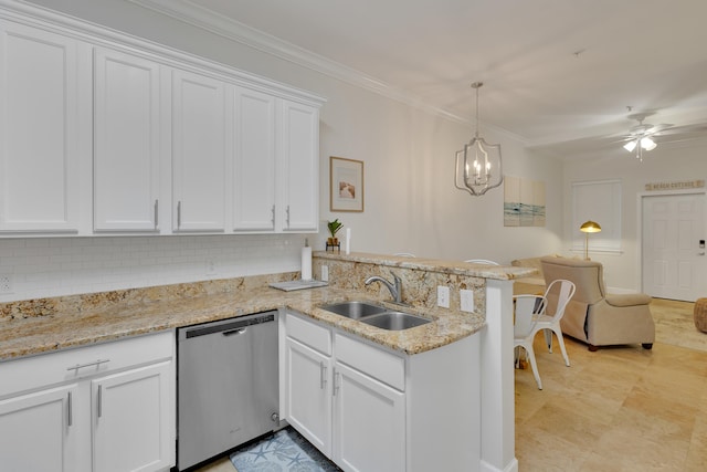 kitchen featuring pendant lighting, white cabinets, ceiling fan with notable chandelier, sink, and stainless steel dishwasher