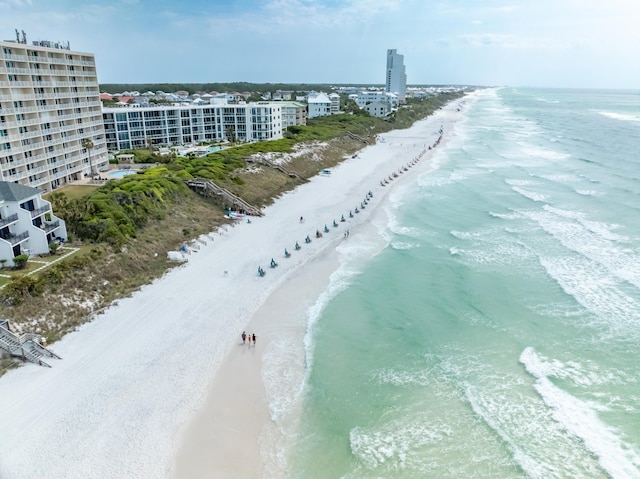 drone / aerial view featuring a view of the beach and a water view