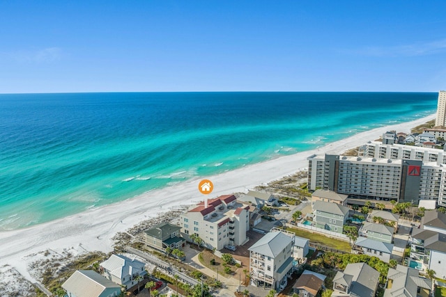 birds eye view of property featuring a view of the beach and a water view